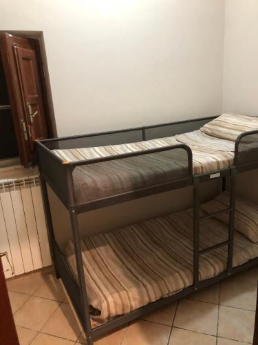 a black bunk bed in a room at Villa Roccia Scura dell'Etna in Zafferana Etnea