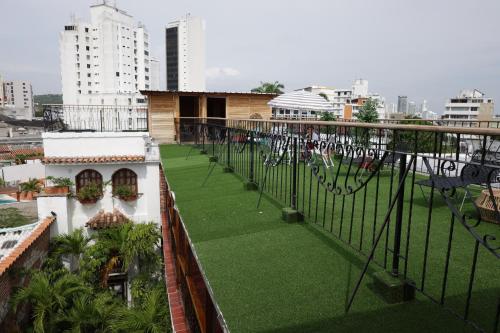 a balcony with a green lawn on a building at Hotel Don Pedro De Heredia in Cartagena de Indias