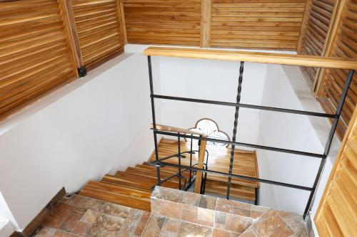 a staircase in a room with wood and white walls at Hotel Don Pedro De Heredia in Cartagena de Indias
