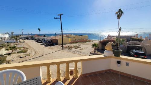 a balcony with a view of a street and the ocean at Campbell's house 2nd row WiFi Las Conchas in Las Conchas