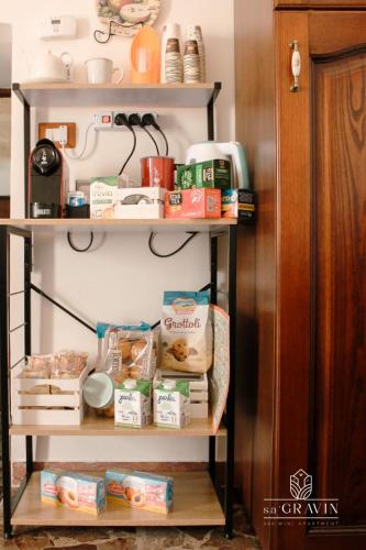 a shelf with food and other food items on it at B&B sa' GRAVIN in Castellaneta