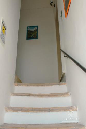a staircase in a building with white walls at B&B sa' GRAVIN in Castellaneta