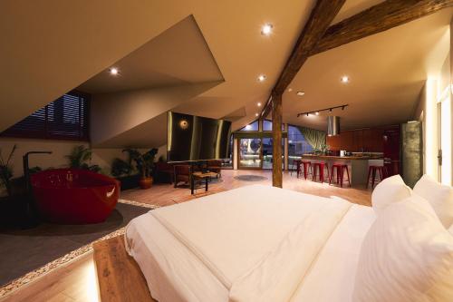 a bedroom with a large bed and a living room at Tare Houses in Istanbul