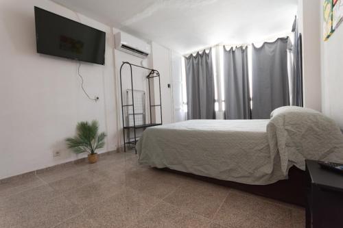 Voodi või voodid majutusasutuse Piso con Piscina comunitaria toas