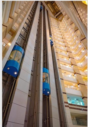 a building with a blue train on the side of it at فندق تارا الروضة in Makkah