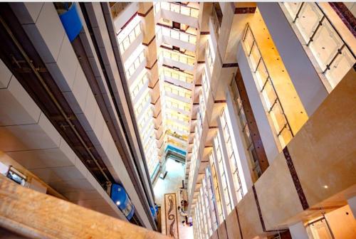 an overhead view of a building with tall windows at فندق تارا الروضة in Makkah
