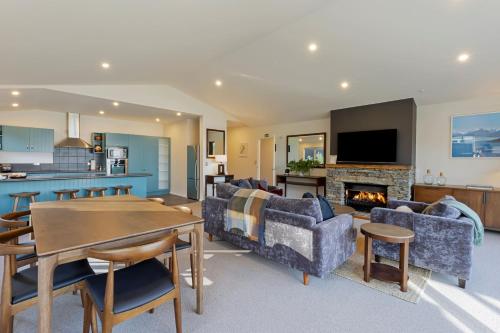 a living room with a couch and a table at Queenstown House Bed & Breakfast and Apartments in Queenstown