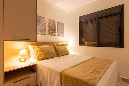 a bedroom with a large bed and a window at Today Perdizes in Sao Paulo