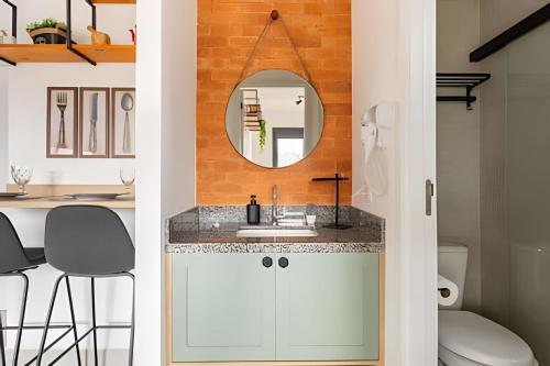 a bathroom with a sink and a mirror at Today Perdizes in Sao Paulo