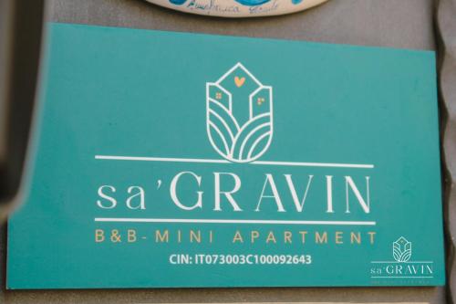 a sign for a scrumiumiumiumiumiumiumiumimumimum at B&B sa' GRAVIN in Castellaneta