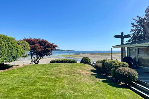 a church with a cross next to a beach at Mintercreek Cabin in Gig Harbor