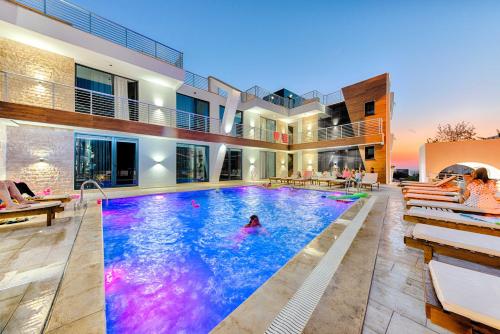 a swimming pool in the middle of a house at Lotos - stan 212 in Dobra Voda