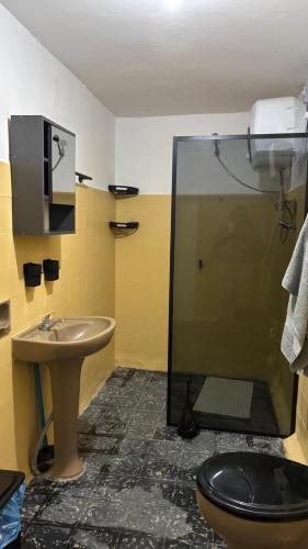 a bathroom with a shower and a toilet and a sink at Casa Chuy Barcelona in Chuy