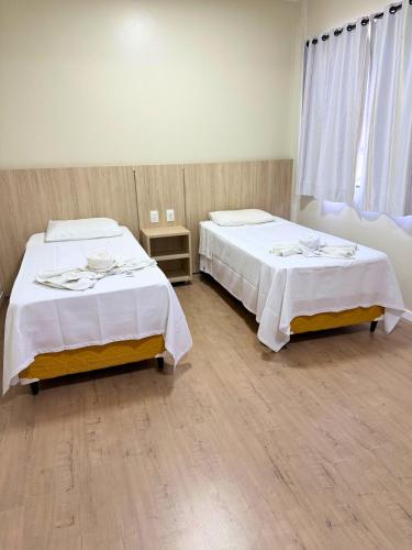 Ένα ή περισσότερα κρεβάτια σε δωμάτιο στο Hotel Ideal Beltrão