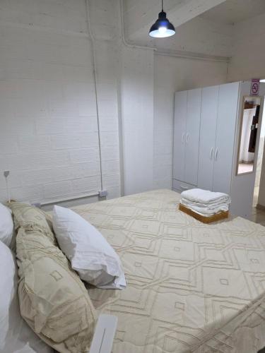 a large room with two mattresses on the floor at Departamento equipado, centrico, cochera cubierta Sarmiento265apart D15 in San Fernando del Valle de Catamarca