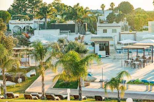 an aerial view of a resort with palm trees at Boomerang Village in Torre Colimena