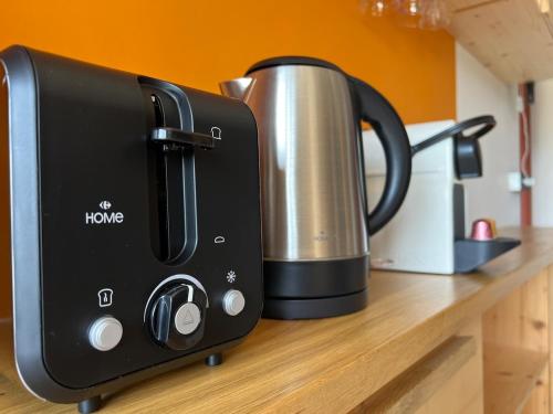 a coffee maker is sitting on a counter at Delrio in Nantes