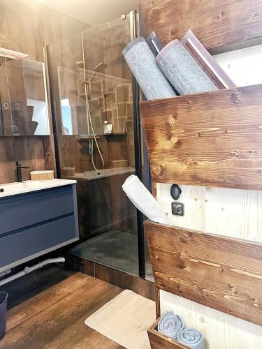 a bathroom with a shower and a sink and a mirror at Delrio in Nantes
