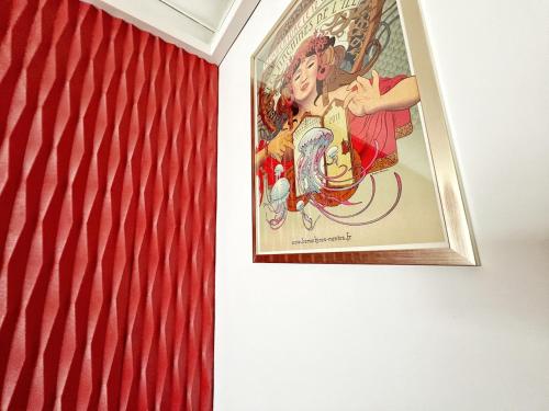 a poster on a wall next to a flag at Delrio in Nantes
