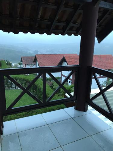 a view from the balcony of a house at Condomínio Serra Nevada - Chalé 202 in Bananeiras