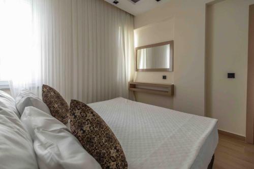 Ένα ή περισσότερα κρεβάτια σε δωμάτιο στο Peramis Hotel & Spa