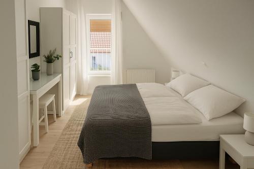 Ένα ή περισσότερα κρεβάτια σε δωμάτιο στο Ferienhaus Pauline - Achterwasser Findling