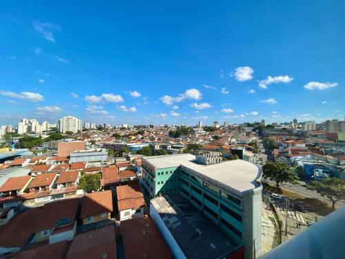 a view of a city with buildings and buildings at Luxury Studio - Aeroporto GRU in Guarulhos