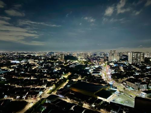 a view of a city at night with lights at Luxury Studio - Aeroporto GRU in Guarulhos