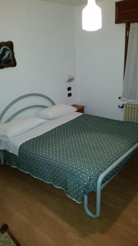 Postel nebo postele na pokoji v ubytování Albergo Ristorante Sciatori