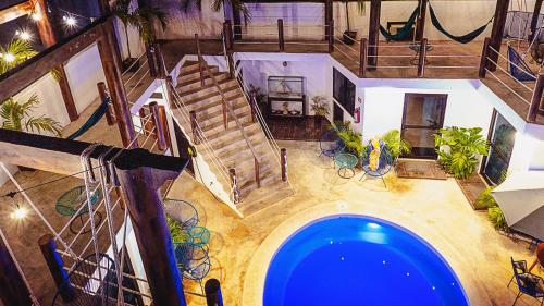 an overhead view of a house with a swimming pool at Ade Hotel Bacalar in Bacalar