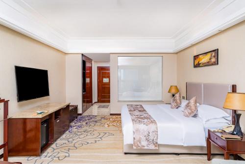 TV a/nebo společenská místnost v ubytování Langfang Arcadia International Hotel