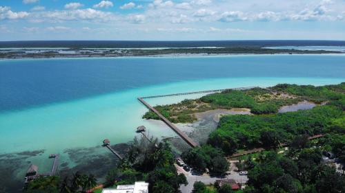 an aerial view of an island in the water at Ade Hotel Bacalar in Bacalar