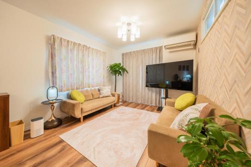 TV a/nebo společenská místnost v ubytování MOMO Garden