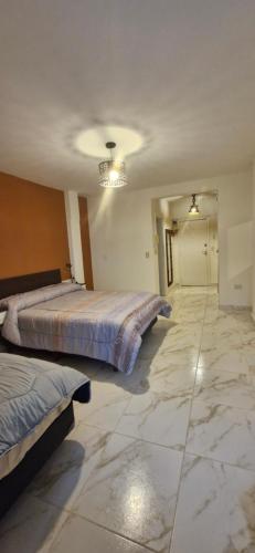 En eller flere senge i et værelse på Tiempos patagónicos de reflexión