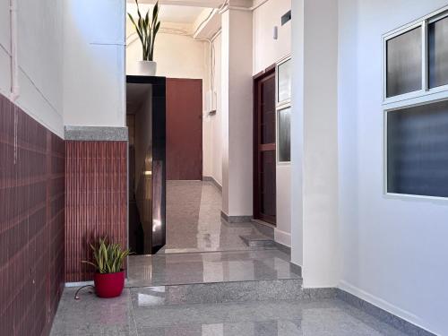 a corridor of a building with a hallway at DEN LODGE in Kulasegaram