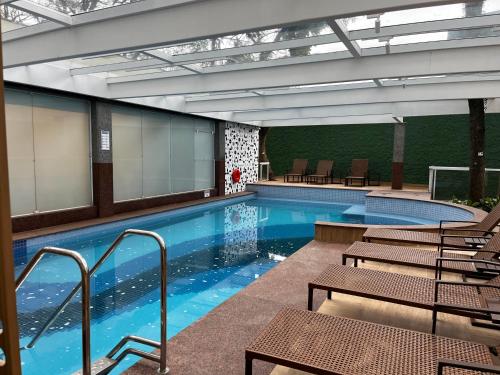 Bassein majutusasutuses Quarto de hotel na Rua Verbo Divino või selle lähedal