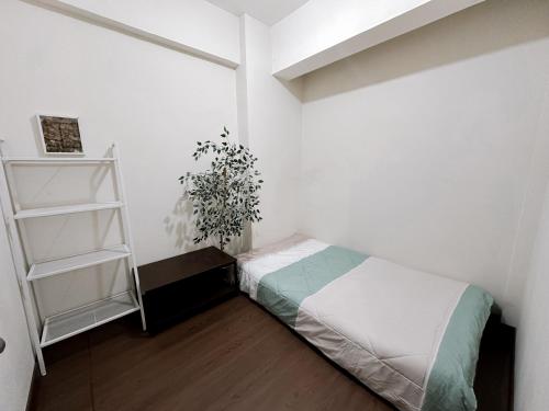 Postel nebo postele na pokoji v ubytování 2Br Apartemen di Jakarta Barat Tibonne House