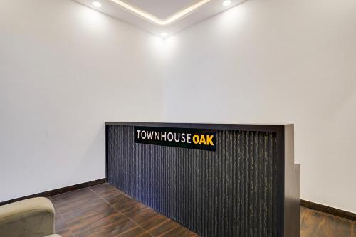 a room with a sign that reads townhouse oak at Townhouse OAK XOTEL near silk board metro in Bengaluru