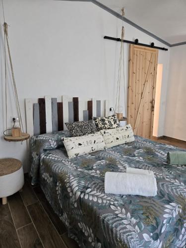 a bedroom with a large bed with pillows on it at CaSAle in Castelfidardo
