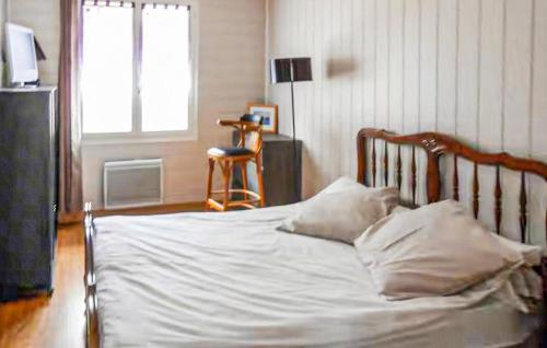 En eller flere senge i et værelse på Agréable Studio Proche Du Lac