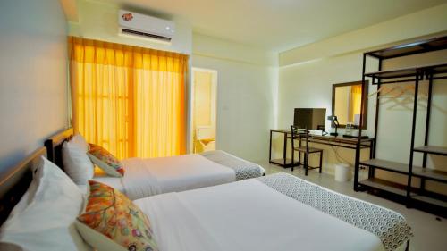 Ένα ή περισσότερα κρεβάτια σε δωμάτιο στο Salin Home Hotel Ramkhamhaeng