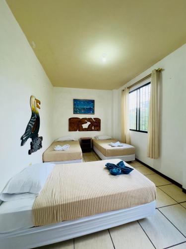 Ένα ή περισσότερα κρεβάτια σε δωμάτιο στο Tintorera Guest House