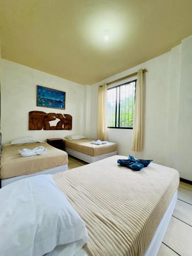 Ένα ή περισσότερα κρεβάτια σε δωμάτιο στο Tintorera Guest House