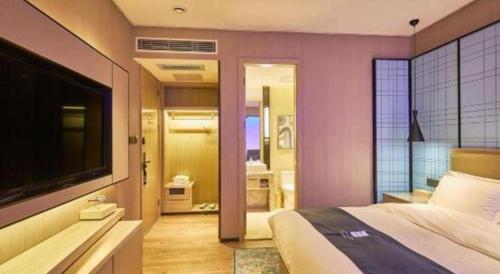 Katil atau katil-katil dalam bilik di Echarm Hotel Liuzhou High-speed Railway Station