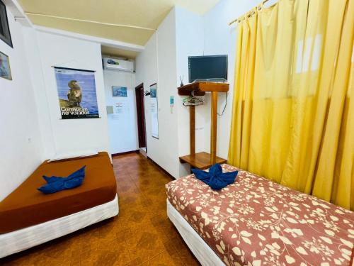 Ένα ή περισσότερα κρεβάτια σε δωμάτιο στο Tintorera Guest House