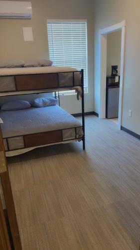 a room with two bunk beds in a room at Willow e-hotel in Mattoon