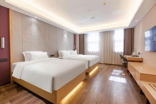 Letto o letti in una camera di Lavande Hotels Jinzhong Youjian Pingyao