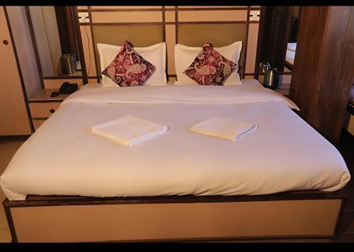 Voodi või voodid majutusasutuse Hotel Sita - The Family choice toas