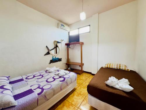 Ένα ή περισσότερα κρεβάτια σε δωμάτιο στο Tintorera Guest House