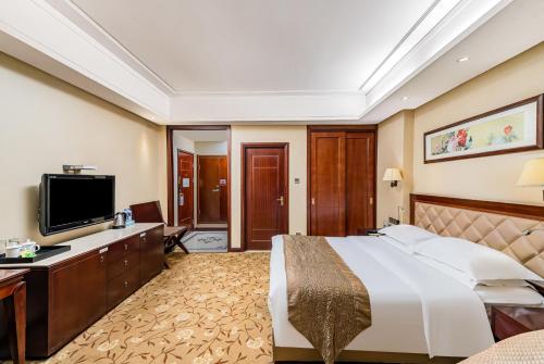 TV a/nebo společenská místnost v ubytování Langfang Arcadia International Hotel